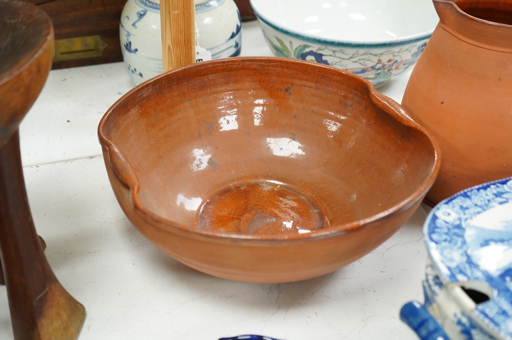 An early 19th century pearlware tureen, a pair of pearlware leaf dishes, a glazed earthenware jug and basin